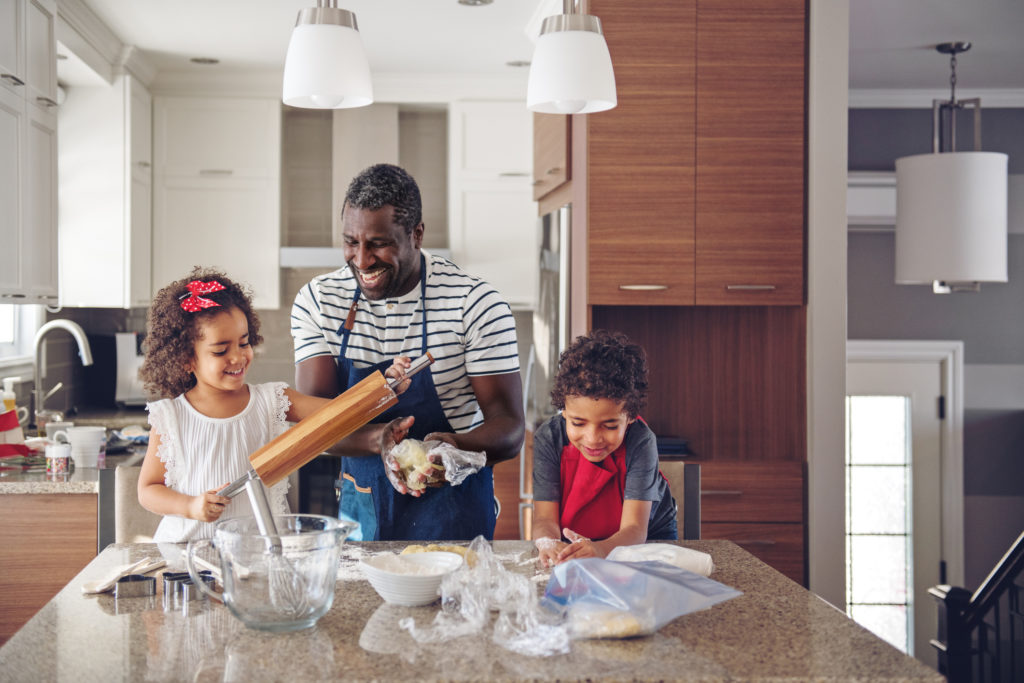 Father cooking with kids